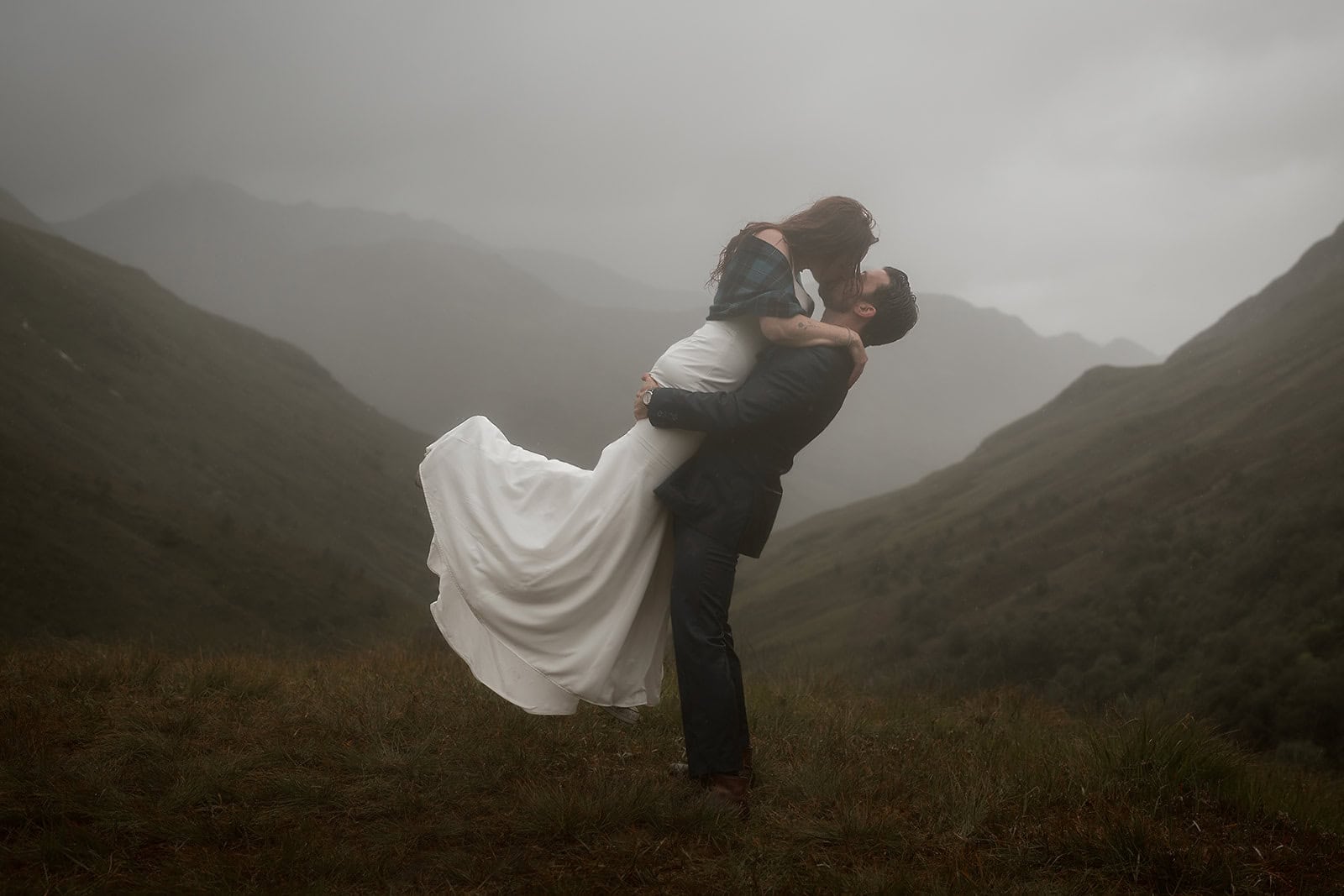 Scottish Highlands elopement with dramatic mountains and rolling green hills