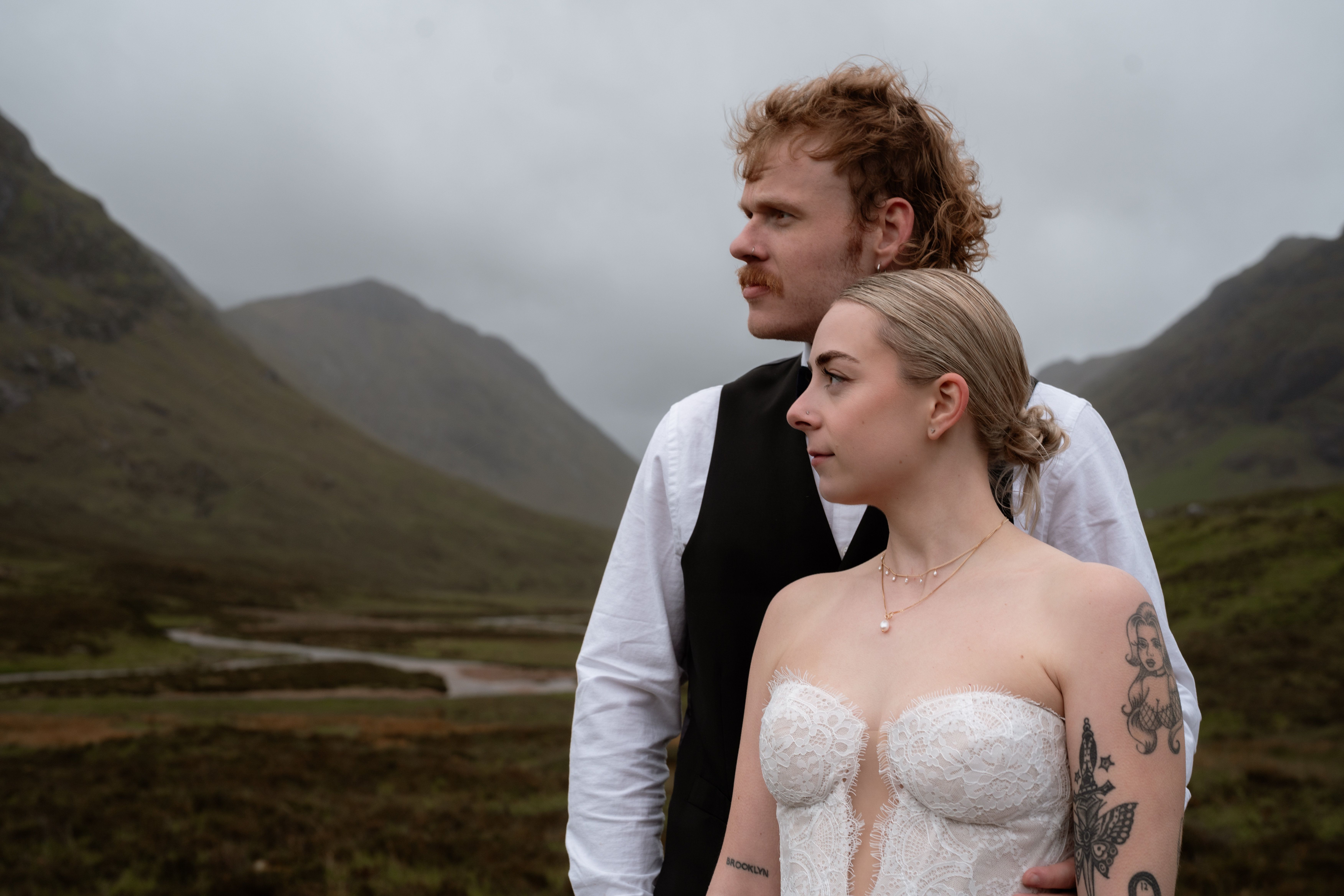 A couple at a small Scottish wedding in a rural setting
