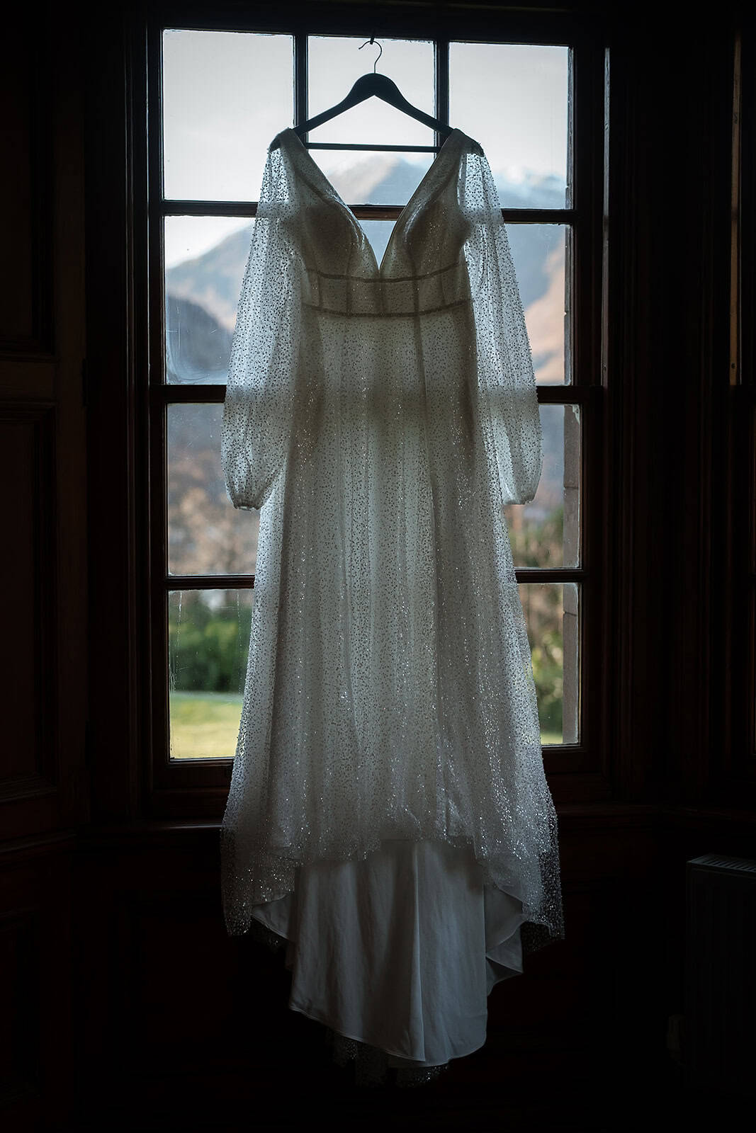 Wedding dress hanging in the window at Glencoe House